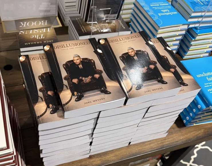 Copies of Disillusioned on display at a conference bookstore
